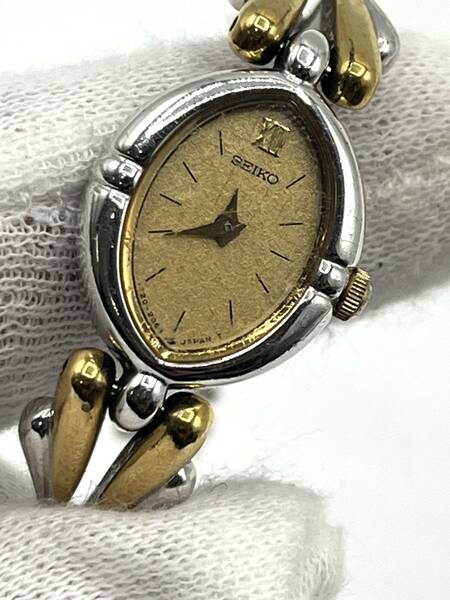 【電池切れ】SEIKO セイコー クォーツ 腕時計 ゴールド文字盤 オーバル コンビ ドレスウォッチ レディース 1E20-598A