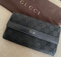 GUCCI レザー 長財布 GG柄 袋付き ウォレット 二つ折り ゴールド 黒 ブラック 本革_画像1