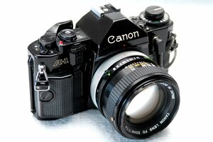 Canon キャノン 人気の高級一眼レフカメラ A-1 ボディ +（純正50mm単焦点高級レンズ1:1.4付） 希少な作動品・（鳴き無し ）（腐食無し）