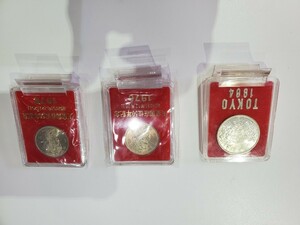 東京オリンピック1000円銀貨、天皇御在位50周年100円