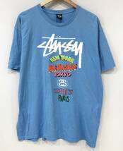 stussy ワールドツアー Tシャツ 水色 ステューシー 古着 SIZE：XL■1102G①_画像1