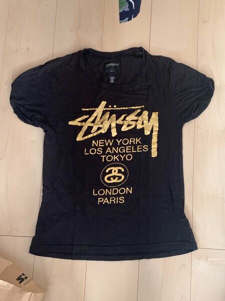 STUSSY ワールドツアー シャツ 半袖 クルーネック ゴールドラメ インド製