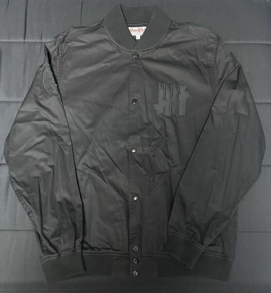 【送料無料】UNDEFEATED Varsity Jacket コットン バーシティジャケット ブラック UNDFTD アンディフィーテッド