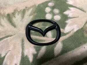 * unused Mazda NC Roadster gloss black emblem front matted black original *