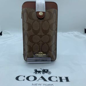 新品未使用　COACH コーチ スマホショルダー クロスボディ カーキ シグネチャー