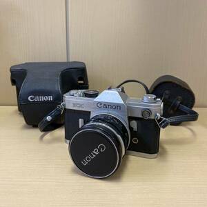 【T1201】Canon キャノン FX フィルムカメラ カバー付き レンズフード付き 動作未確認 詳細不明 キズあり 汚れあり 長期保管品