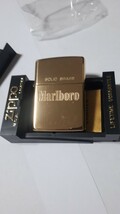 未使用　Marlboro　Zippo　SOLID　BRASS　マルボロジッポー　ソリッドブラス　ハイポリッシュ仕上げ　1991年製造　希少品　懸賞品_画像1