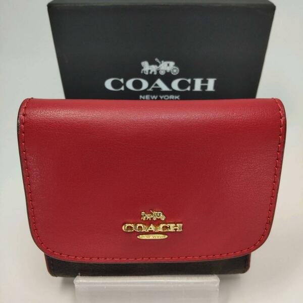 COACH コーチ シグネチャー柄 折りたたみ財布 レッド です。