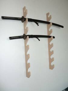 * new goods * limited commodity * wall use * sword * wooden sword 8ps.@ for holder * self . storage.