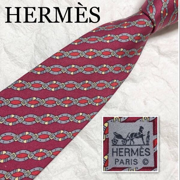 ■美品■HERMES エルメス　ネクタイ　レジメンタルストライプ　ベルト　総柄　シルク100% フランス製　ピンク、レッド系