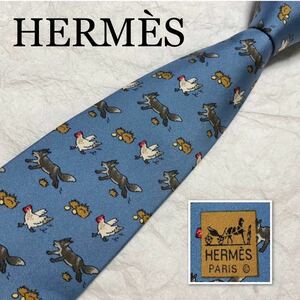 ■美品■希少デザイン■HERMES エルメス　ネクタイ　ニワトリを襲うキツネ　鶏　卵　シルク100% フランス製　ライトブルー