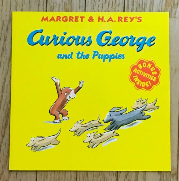 『CURIOUS GEORGE AND THE PUPPIES おさるのジョージ こいぬをかう』　洋書　絵本　ペーパーバッグ　