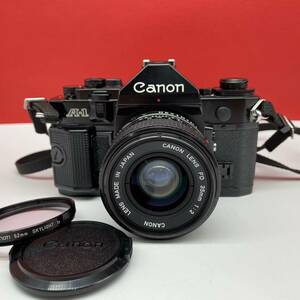 □ Canon A-1 フィルムカメラ 一眼レフカメラ LENS NEW FD 35mm F2 レンズ 動作確認済 現状品 キャノン