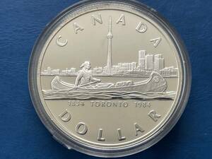 【カナダ1ドル銀貨：1984年1ダラー銀貨、トロント100年記念、未使用、プルーフ、カタログ値（約23.3ｇ、silver500、36ｍｍ）】銀貨　J114☆
