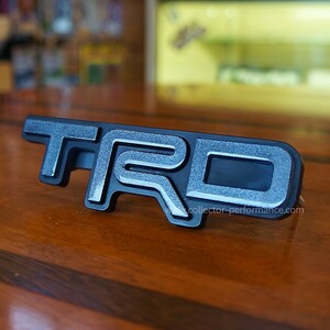 Taco Vinyl/タコビニール TRD グリルバッジ メタリックグレー