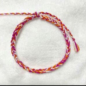 ミサンガ アンクレット ブレスレット 刺繍糸 アクセサリー ハンドメイド 白 紫 オレンジ ホワイト パープルの画像1