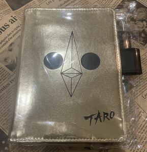 [ Okamoto Taro ] sun. . yellow gold. face almost day pocketbook cover A6 size [ free shipping ]