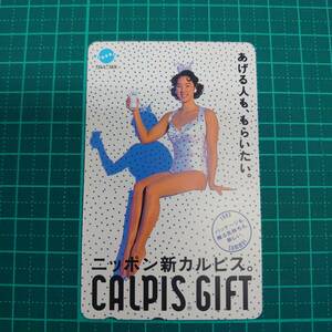 ＃3458D【未使用　テレカ　50度　小谷実可子　水着　ワンピース　白色　水玉柄　CALPIS/カルピス　美品　保管品】