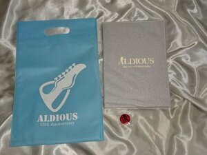 Aldious ブックカバー付き15年記念ヒストリー&フォトブック(初版) ホログラム缶バッジ 不織布バッグ アルディアス