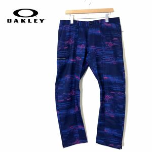 I2140-N◆美品◆ OAKLEY オークリー ロングパンツ スラックス ゴルフパンツ スカル ストレッチ ◆ size34 パープル ネイビー 総柄 ポリ