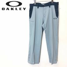 F354-F-N◆ OAKLEY オークリー ゴルフスラックス パンツ ジッパーフライ ◆ size36 ポリエステル100 グレー グリーン 古着 メンズ_画像1