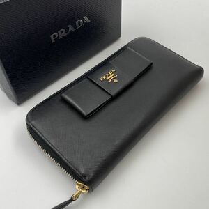 H543【美品】★PRADA★プラダ サフィアーノ　二つ折り長財布　1M0506 レザー リボン ラウンドファスナー　レディース NERO 