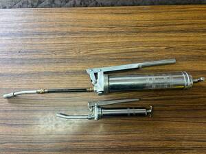  grease gun large small two piece set CAT. clear writing have 