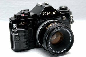 Canon キャノン 人気の高級一眼レフカメラ A-1 ボディ +（純正50mm単焦点高級レンズ付） 希少な作動品・（鳴き無し ）（腐食無し）