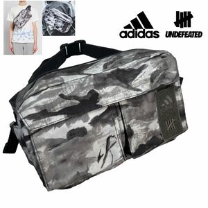 美品 adidas×undefeated アディダス アンディフィーテッド コラボ ランニングバッグ ボディーバッグ 総柄 グレー ブラック 別注 A2159