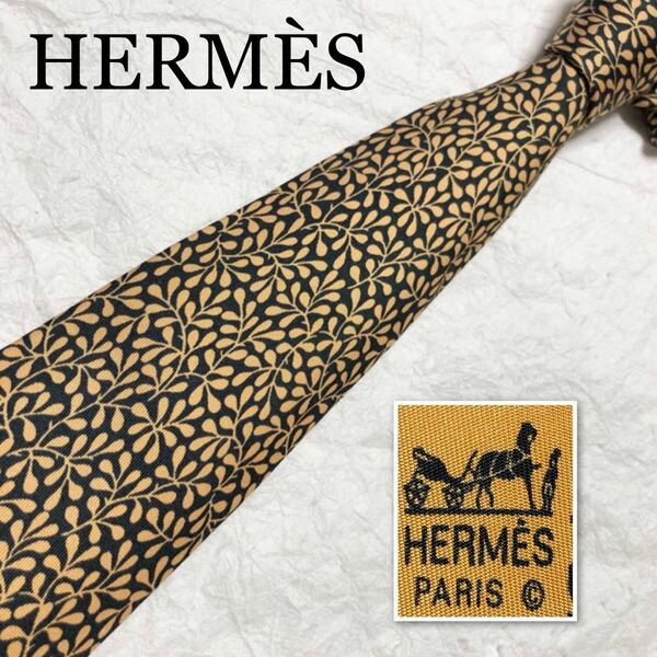 ■表側美品■HERMES エルメス　ネクタイ　葉っぱ　総柄　シルク100% フランス製　ブラック×ゴールド