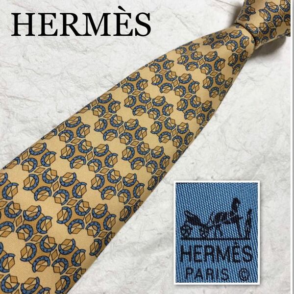 ■美品■HERMES エルメス　ネクタイ　丸　菱形　馬蹄　総柄　シルク100% フランス製　イエロー系×ブルー