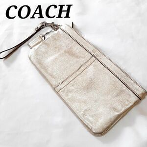 美品　コーチ　リストレットポーチ　クラッチバッグ　ゴールド　パーティー　結婚式　チャームつき　COACH 小物入れ ストラップ