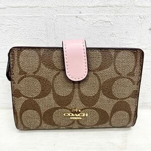 1401◎ COACH コーチ 財布 折り畳み 2つ折り お札入れ カード入れ 小銭入れ あり シグネチャー カジュアル ブラウン ピンク レディース