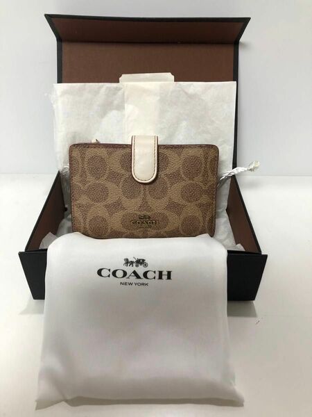 美品　二つ折り財布 COACH コーチ 33034 シグネチャー柄 ブラウン/オフホワイト