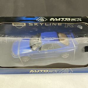 ▽ AUTOart 1/18 日産 スカイライン GT-R R34 Vスペック II ベイサイドブルー ダイキャストモデルカー / 262343 / 329-1の画像1