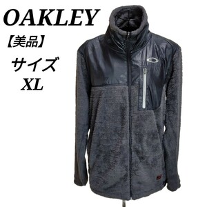 オークリー OAKLEY 美品 フリースジャケット 長袖 アウター アウトドア XLサイズ ジップアップ グレー メンズ