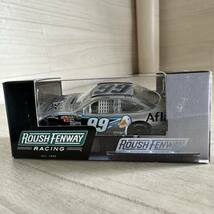 【A0310-10】未開封品『Action 1/64 ナスカーCarl Edwards #99 Aflac Silver 2010 Fusion C990865A7CE』ミニカー レーシングカー_画像1