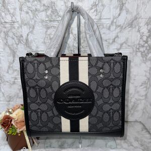 新品★COACH デンプシー トート22シグネチャージャカードC7083