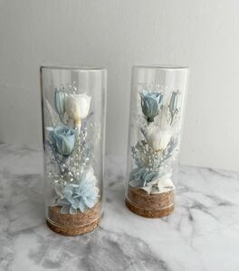  preserved flower * Mini glass bottle against blue *. flower for pets also 