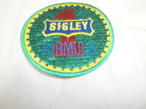 F1 badge ~SISLEY~si attrition -1980 period Benetton gel Hal to*be Luger 