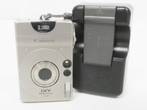 02 67-591656-18 [Y] Canon キャノン IXY DIGITAL PC1001 イクシー デジタル カメラ バッテリー 充電器付き 旭67_画像1