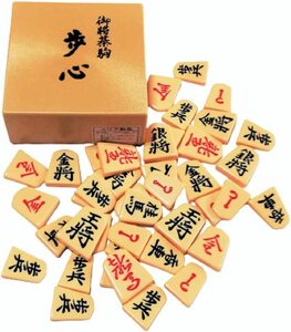 【新品】将棋駒・歩心駒（裏・赤）プラスチック製（駒箱付）