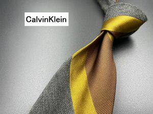 【超美品】CalvinKlein　カルバンクライン　レジメンタル柄　ネクタイ　3本以上送料無料　ブラウン系　0303011