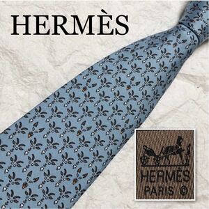 HERMES エルメス　ネクタイ　山羊と狼　ヤギ　オオカミ　顔　総柄　シルク100% フランス製　ライトブルー