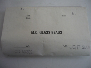 7701.未使用 チェコビーズ M.C.GLASS BEADS SMOKE LIGHT SIAM(ライトシャム)