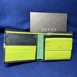 T143/【中古品】GUCCIグッチ 二つ折り財布 シマ GG 282023 ブラック バイカラーの画像4