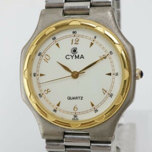 2403-534 シーマ クオーツ 腕時計 CYMA 703 金色ベゼル 飛び数字 クリーム文字盤 竜頭装飾 純正ブレス