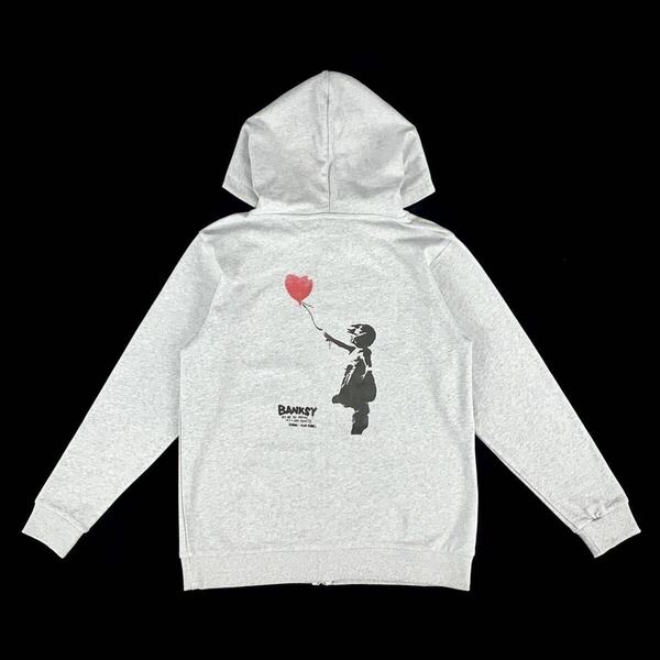 新品 BANKSY バンクシー 愛はごみ箱の中に 風船と少女 シュレッダー 左向き バックプリント ジップアップ パーカー オーバーサイズ XL(LL)