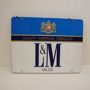 # that time thing cigarettes L&M Philip Maurice shop front signboard @ enterprise thing cigarettes smoke .