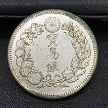 319-1　明治銀貨　古銭　明治9年　貿易銀　総重量約27g　直径約38.85mm_画像1